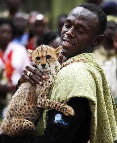 Usain Bolt celebrating his olympic victory with his son