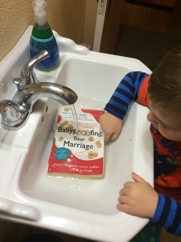 Walked in the bathroom to find our precious child washing a book he found