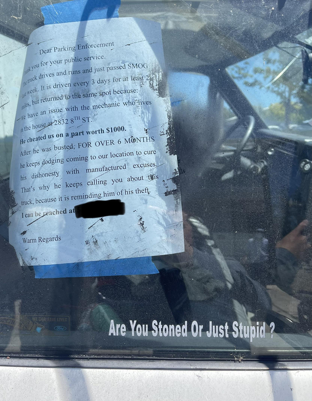 Walked up on parking enforcement reading this note addressed to parking enforcement