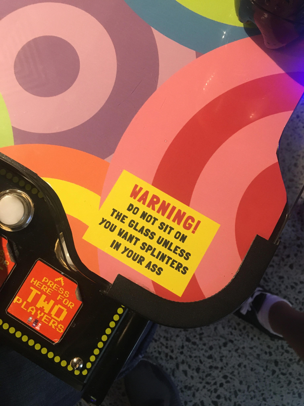 warning sticker at this arcade