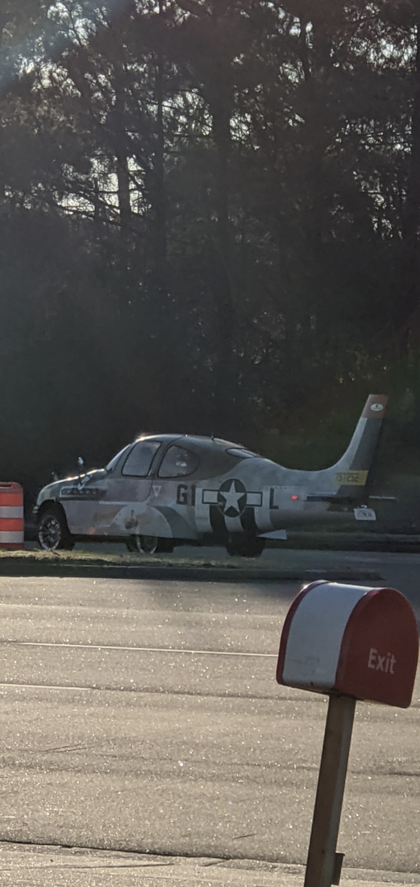 Wartime era plane combined with a car