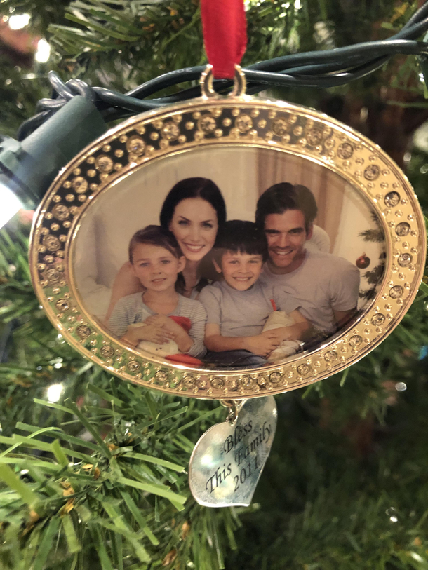 We bought this eight years ago and never replaced the picture My sons calls it our alternate reality family Christmas pic