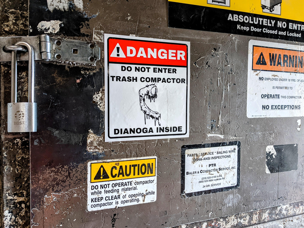 We got a new warning sign for the trash compactor