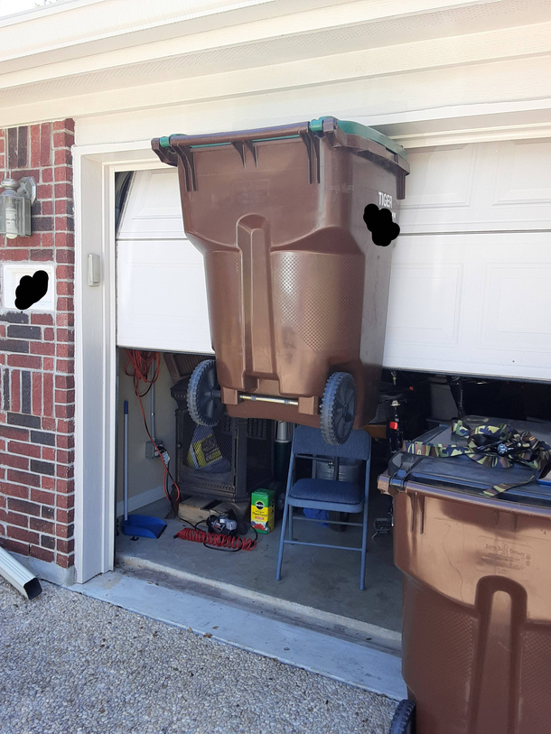 We were opening the garage door and handle caught the trash can