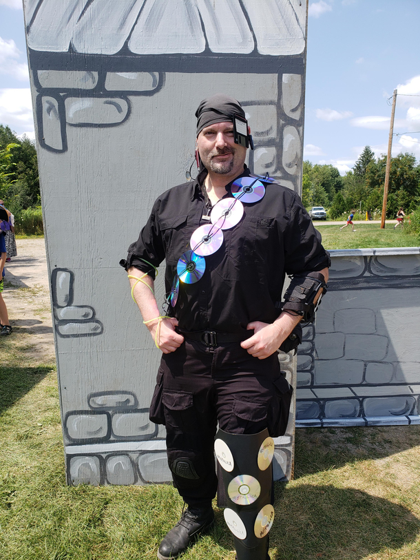 Went to a pirate festival as an internet pirate Among the props are an old A-drive disc as a patch glow in the dark necklace as LimeWire and Bootleg Metallica CDs on my left leg