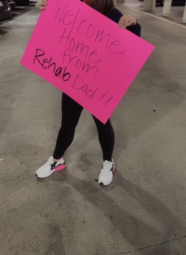 Wife picking her dad up at the airport after a year long trip