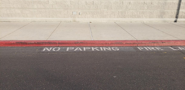 Work repainted the NO PARKING street text a few months ago and I only just now noticed theres a typo