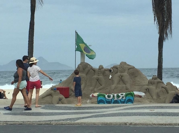 Young man getting a sex education via sand sculpture Mom is not impressed