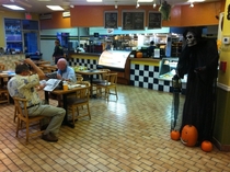  of the folks at this coffee shop are elderly Makes their Halloween decoration seem irresponsible