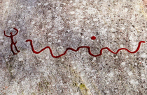 year old petroglyph of a man running away from a snake