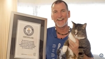 A cat super excited to win a world record