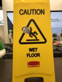 A coworker of mine slipped at work Someone decided to post his face on the wet floor sign