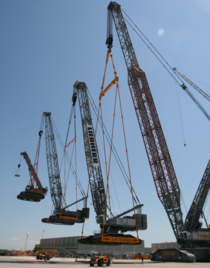 A giant crane lifting a huge crane lifting a big crane lifting a crane