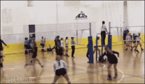 A girl hits a volleyball with her face instead of her hands