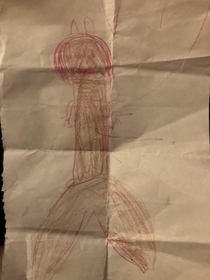 A kid drew a mermaid at the daycare I work at