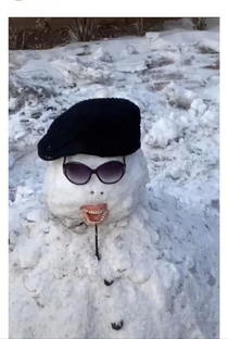 A kid took his grandmas dentures to build the snowman