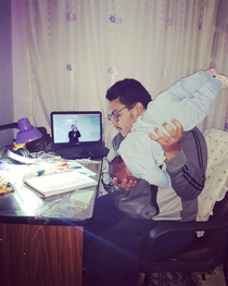 A medical student studying babys positions during labour on his son