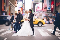 A photographer was taking wedding pictures for a couple when he noticed a familiar face in one of the pictures