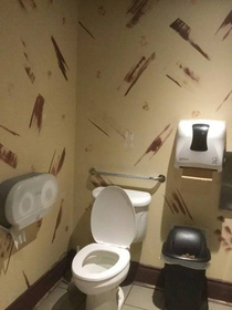 A poor choice of wallpaper for a bathroom