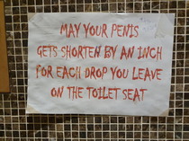 a sign at a restaurants toilet