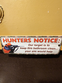 a sign in a public bathroom