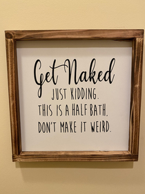 A sign my mom put up in her extra bathroom