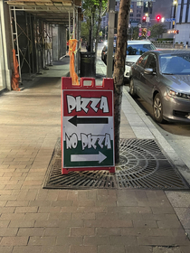 A sign to attract customers to a pizza place in Pittsburgh