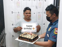 A suspect arrested on his birthday was surprised with a cake by police officers