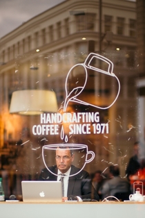 A very serious man in a coffee shop