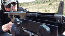 AA- automatic shotgun cut in half firing in slow motion