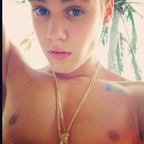 Am I the only one who thinks this picture of Justin Bieber looks like a topless girl with her hair up