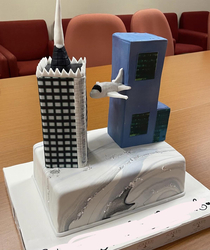 An executive is moving from one regional building to another so a colleague of mine made him a cake he didnt think the design through