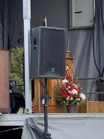 At my graduation ceremony and the speaker is blocking my view of the speaker