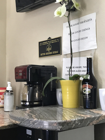 Bottle o Baileys right next to the coffee maker in the lobby at local mechanic shop Dont drink and drive kids