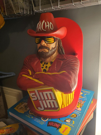 Bought this decommissioned Macho Man Slim Jim convenience store display for  bucks Using it as a remote control organizer
