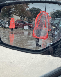 Chick-fil-a workers with the human traffic cone look