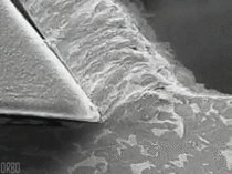 Close up super slow motion shot of mild steel on a lathe