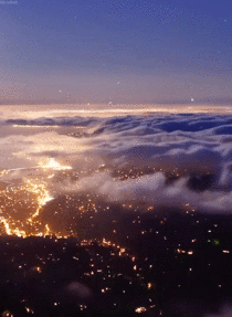 Clouds over city lights