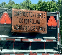 Construction truck on the Merritt Parkway with a particularly accurate sign