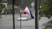 Could be photoshopped but it sums up yesterdays storm in Sydney