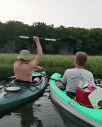Cracking open a beer with a paddle