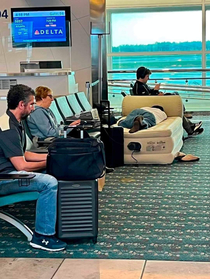 Delta Passenger Puts Down Mattress And Goes To Sleep At The Gate