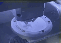 Dental crowns getting milled out of a solid block of zirconium oxide