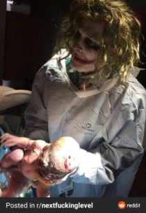 Doctor delivers a baby in his Halloween costume