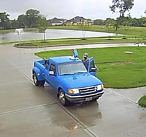Dominos Delivery driver in a Ford Ranger Dually