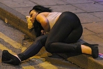 Drunk girl using pizza slice as a pillow