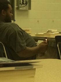 Dude in my class is so bored he is literally burning the fucking desk