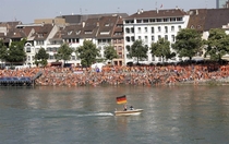 Dutch fans are watching a game against Germany on a big screen over the river Suddenly