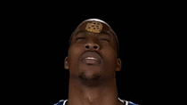 Dwight Howard eating a cookie placed on his forehead