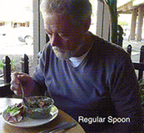 Electronically stabilized spoon helping someone with Parkinsons 